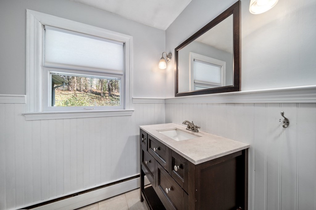 9 Bailey Lane Georgetown, MA 01833 - Photo 28 of 42 a bathroom with a sink and a mirror