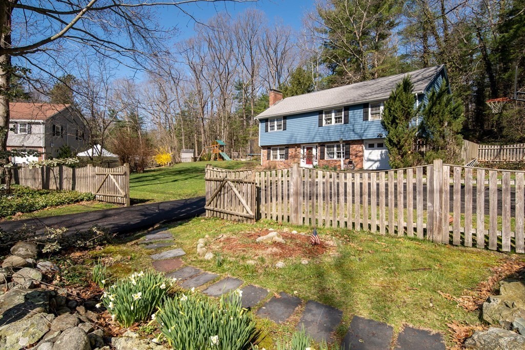 9 Bailey Lane Georgetown, MA 01833 - Photo 3 of 42 a view of a house with a wooden fence