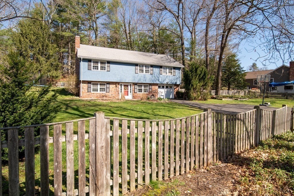9 Bailey Lane Georgetown, MA 01833 - Photo 35 of 42 a view of a house with a wooden fence