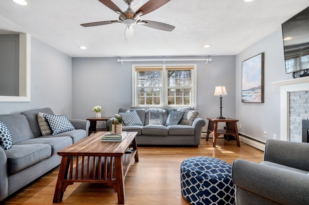 9 Bailey Lane Georgetown, MA 01833 - Photo 7 of 42 a living room with furniture a rug and a window
