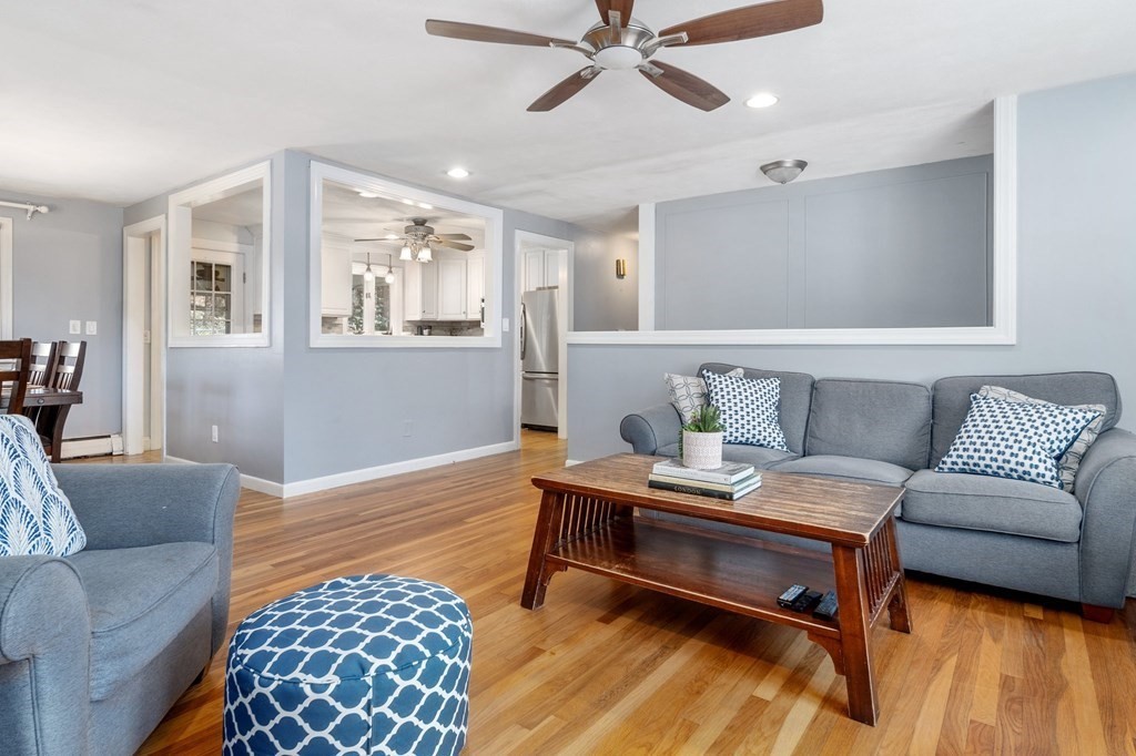 9 Bailey Lane Georgetown, MA 01833 - Photo 8 of 42 a living room with furniture and a wooden floor