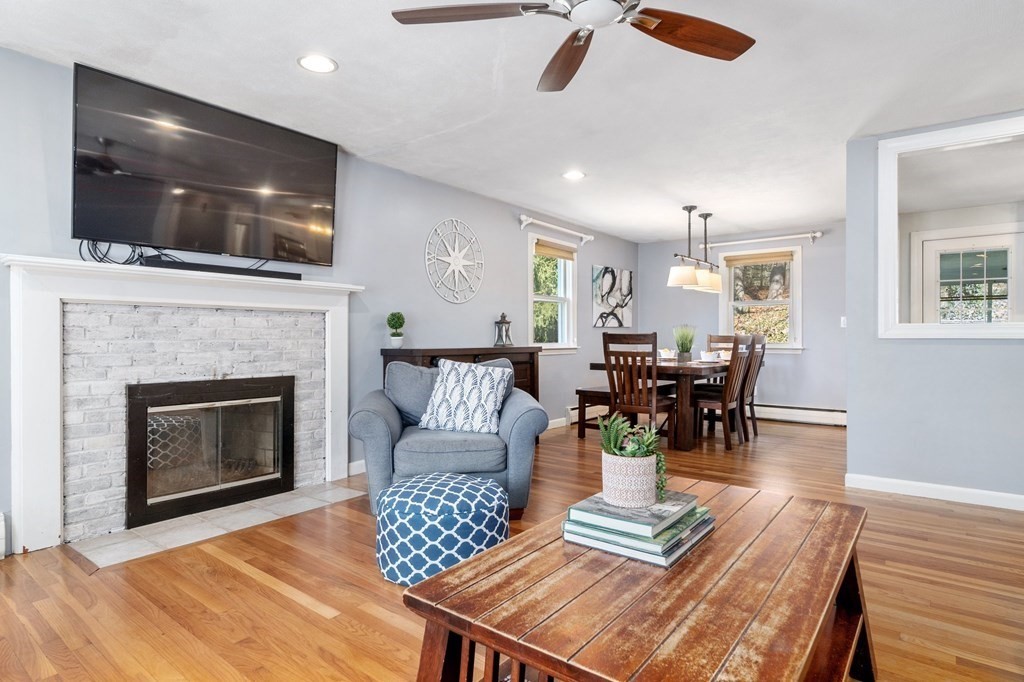 9 Bailey Lane Georgetown, MA 01833 - Photo 9 of 42 a living room with furniture and a flat screen tv