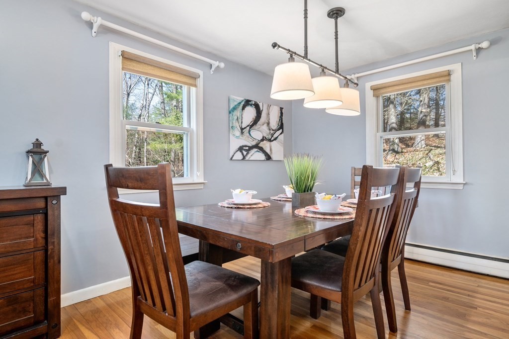 9 Bailey Lane Georgetown, MA 01833 - Photo 10 of 42 a view of a dining room with furniture window and wooden floor