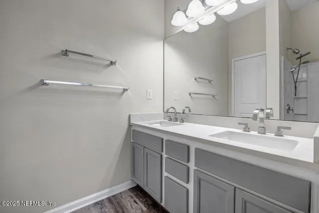 a bathroom with a sink a vanity and a mirror