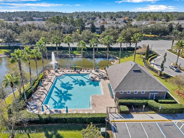 an aerial view of a house with a lake view