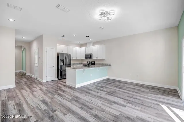 a view of kitchen with wooden floor