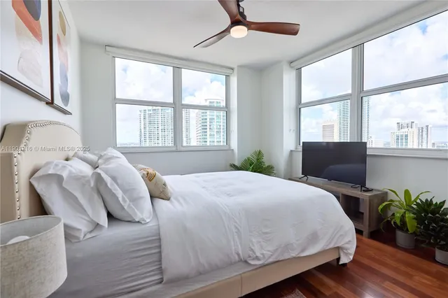 a bedroom with a bed chair and window