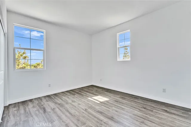 a bathroom with a sink toilet vanity and shower