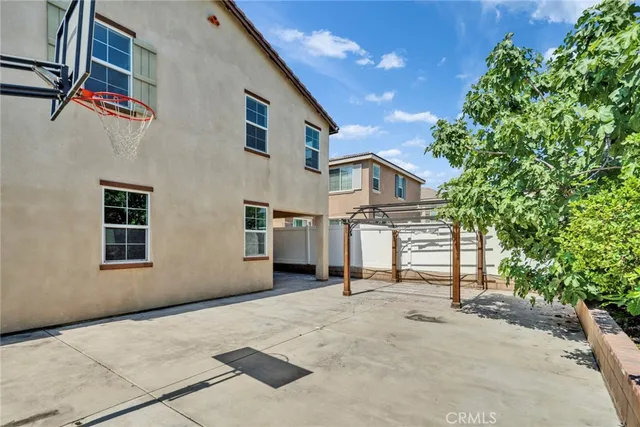 an aerial view of multiple houses with a yard