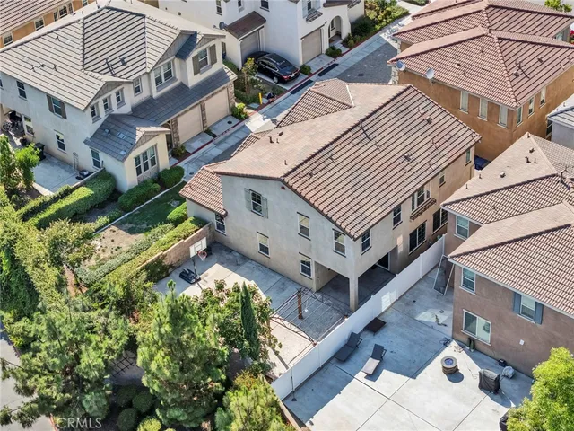 an aerial view of residential houses and outdoor space