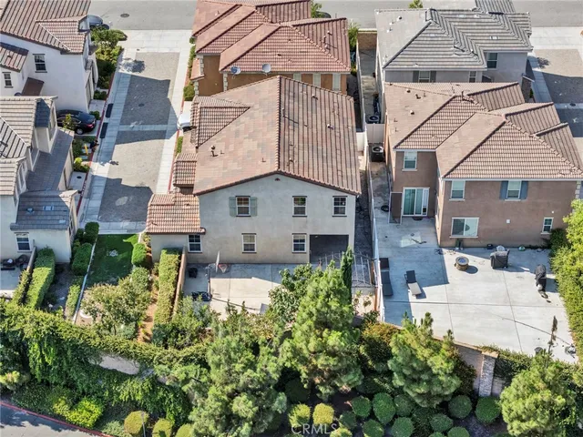 a view of a street with wooden fence