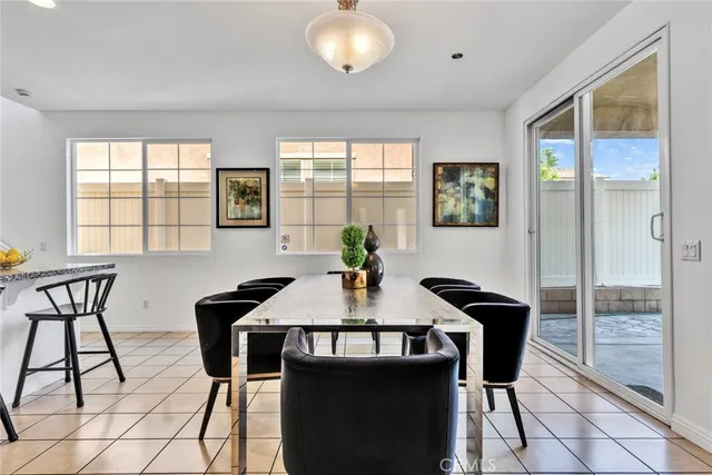 a view of a dining room with furniture and window
