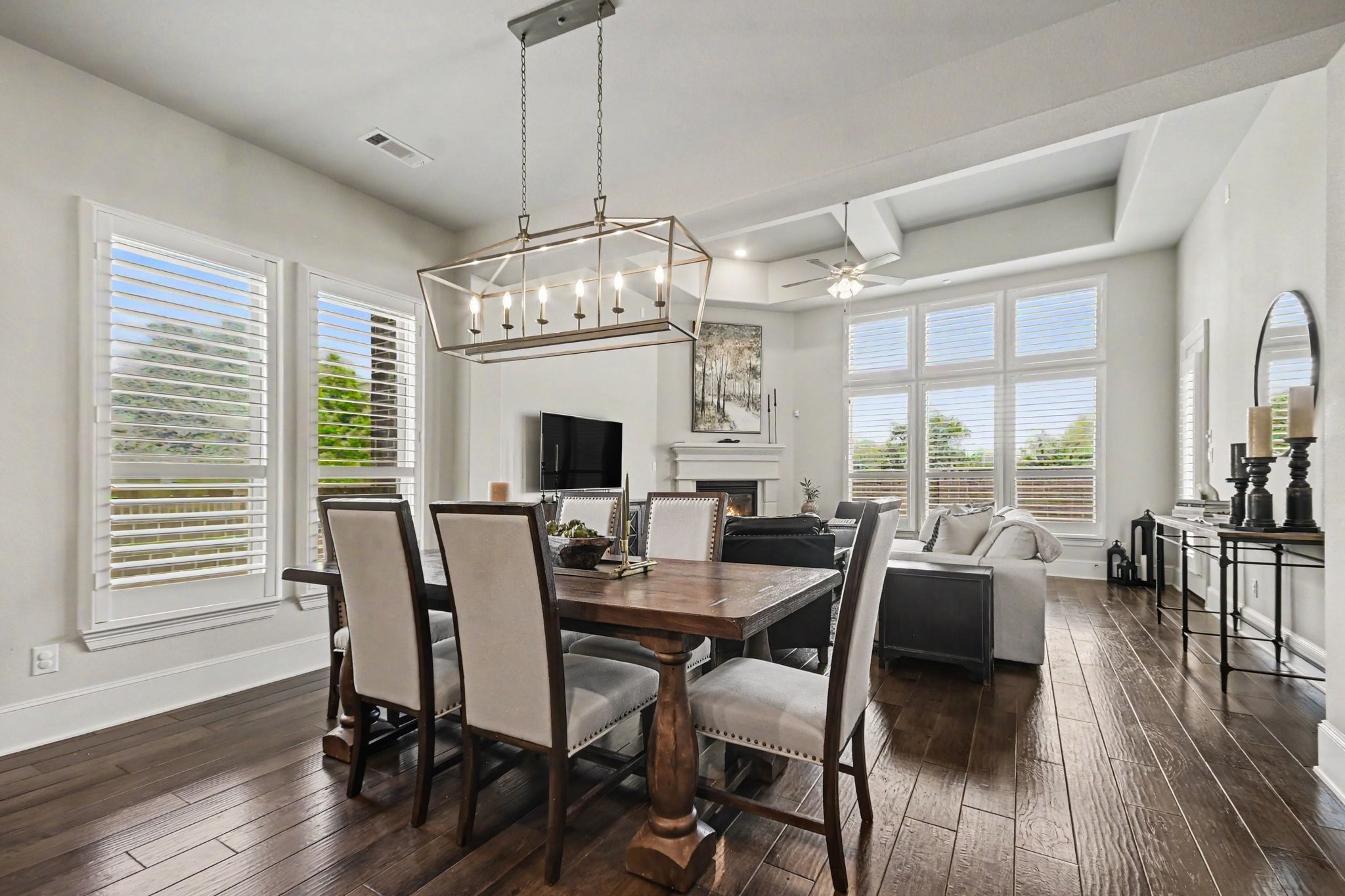 641 Kickapoo Court Webster, TX 77598 - Photo 11 of 39 Bright and inviting open-concept dining area and living room featuring natural light and spacious layout.