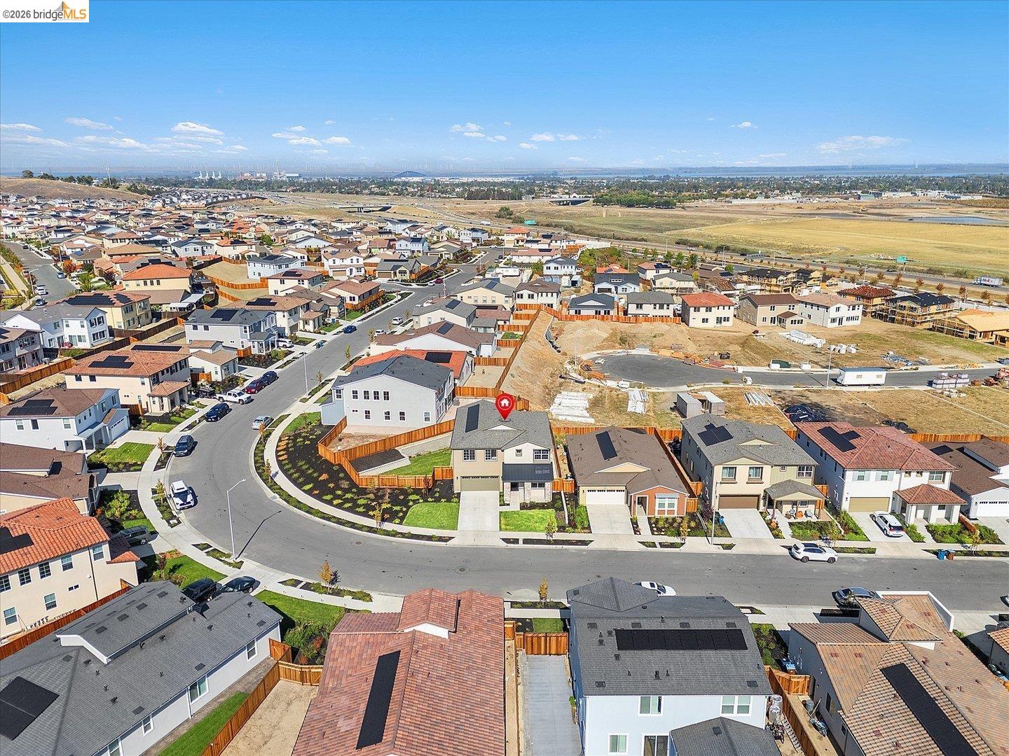 5601 Ridgepoint Way Antioch, CA 94531 - Photo 50 of 59 Aerial view of a residential community featuring a cul-de-sac street design, varied rooflines, solar panel installations, and new construction development