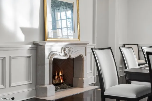 a view of a livingroom with furniture and a fireplace