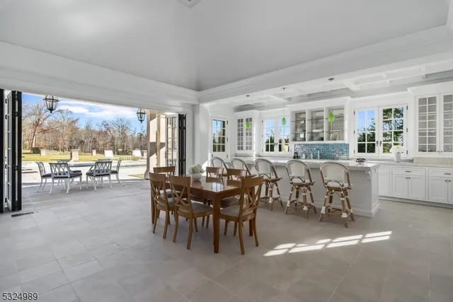 a view of a dining room with furniture and a fireplace