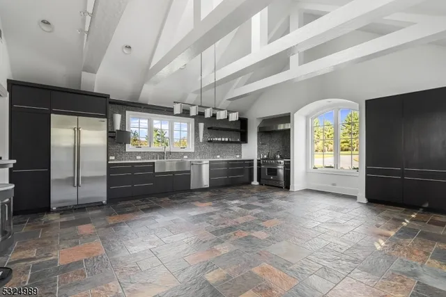 an aerial view of a house having yard