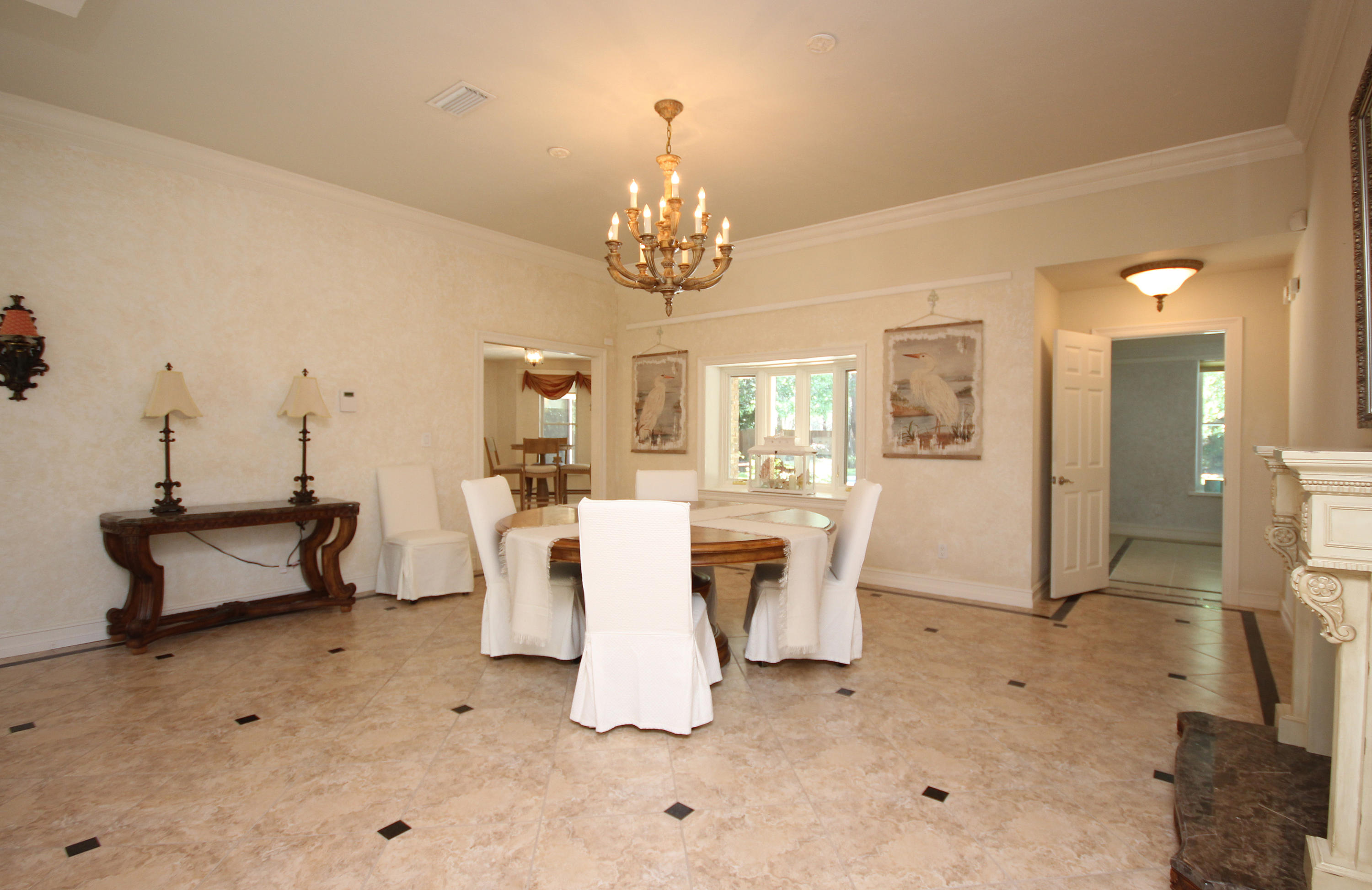 497 Walton Way Miramar Beach, FL 32550 - Photo 13 of 47 a living room with furniture a dining table and a chandelier