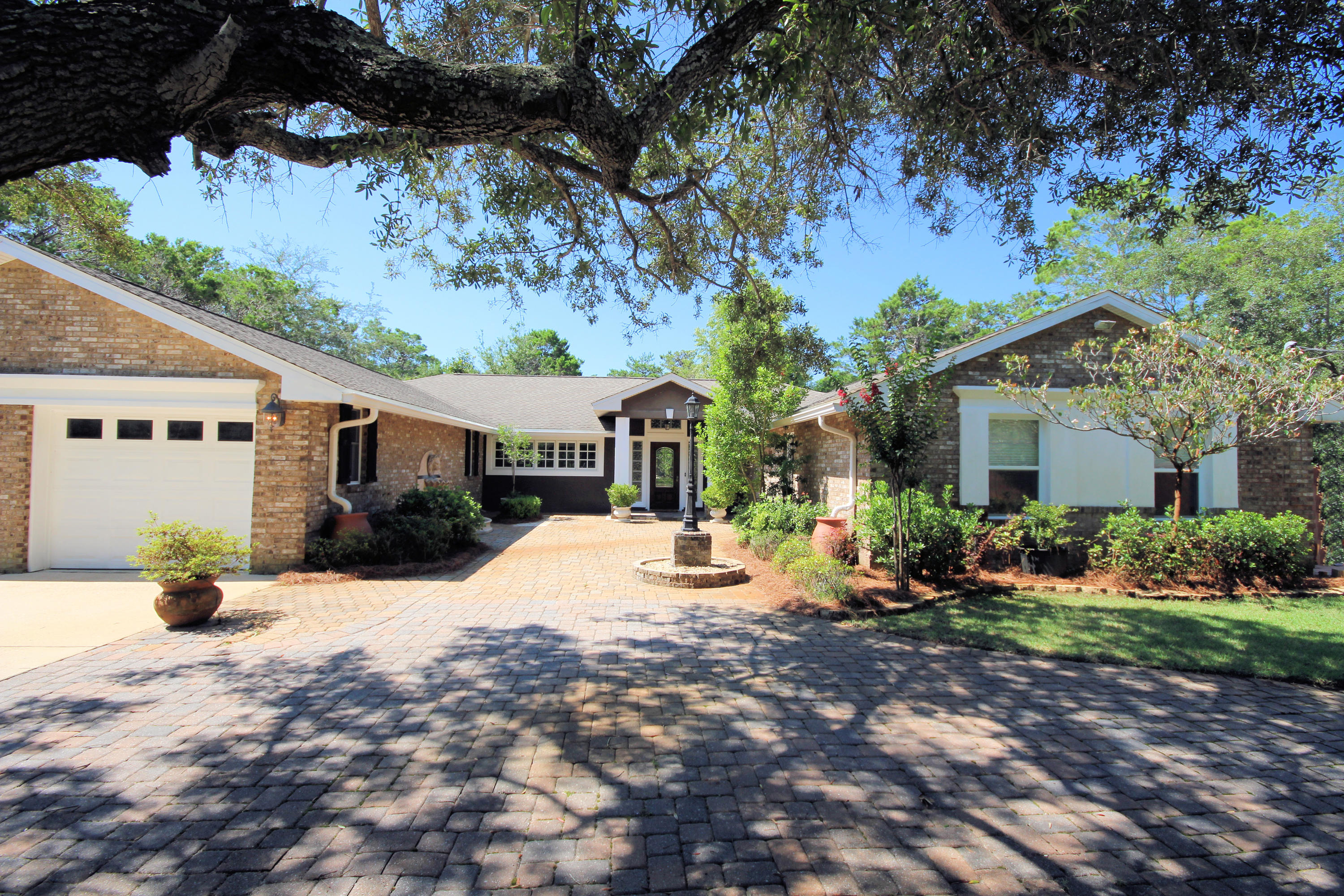 497 Walton Way Miramar Beach, FL 32550 - Photo 3 of 47 a view of a house with backyard sitting area and seating area