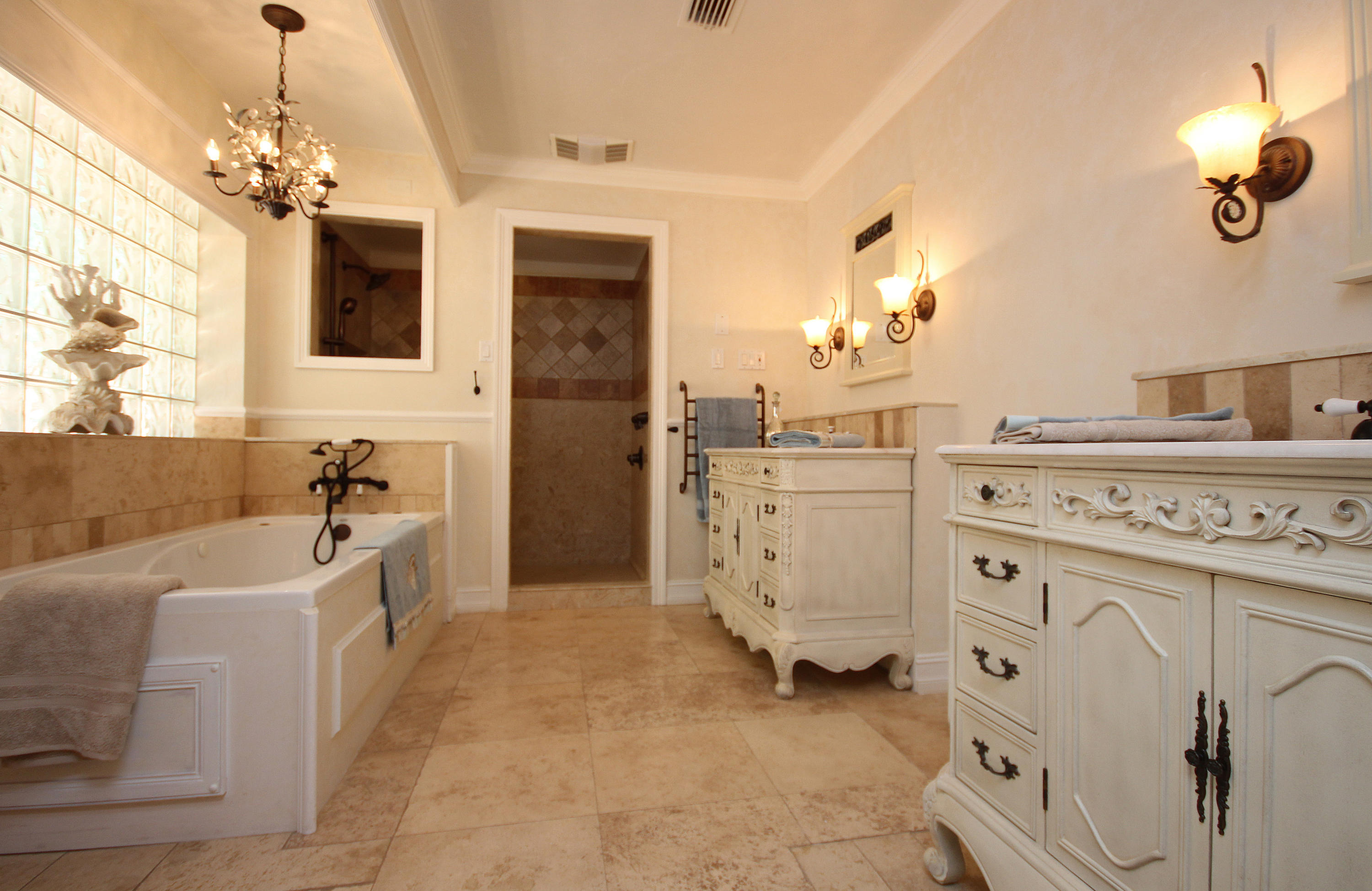 497 Walton Way Miramar Beach, FL 32550 - Photo 22 of 47 a spacious en suite bathroom with a double vanity sink a mirror a bathtub and shower