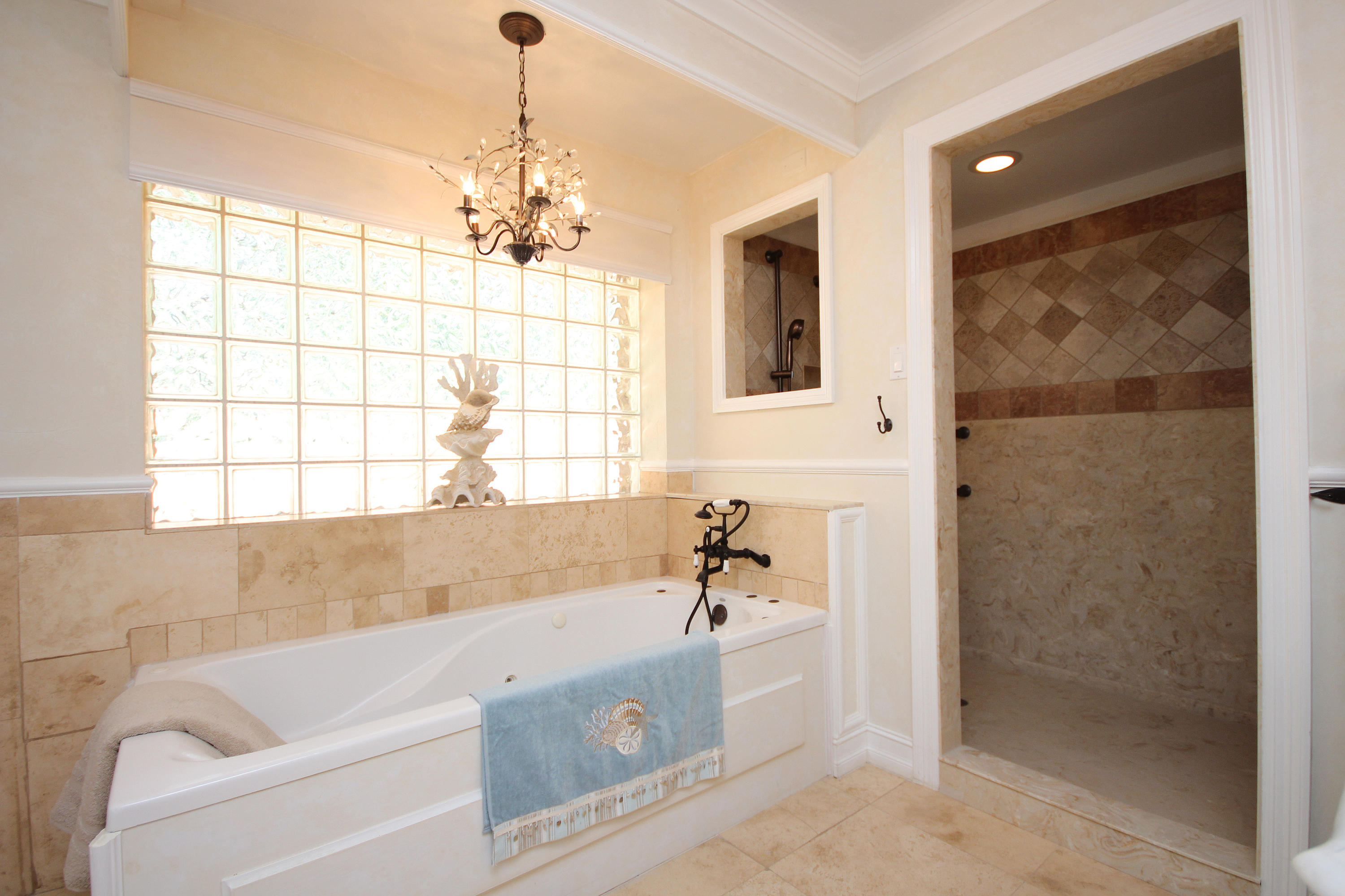 497 Walton Way Miramar Beach, FL 32550 - Photo 23 of 47 a bathroom with a bathtub and shower