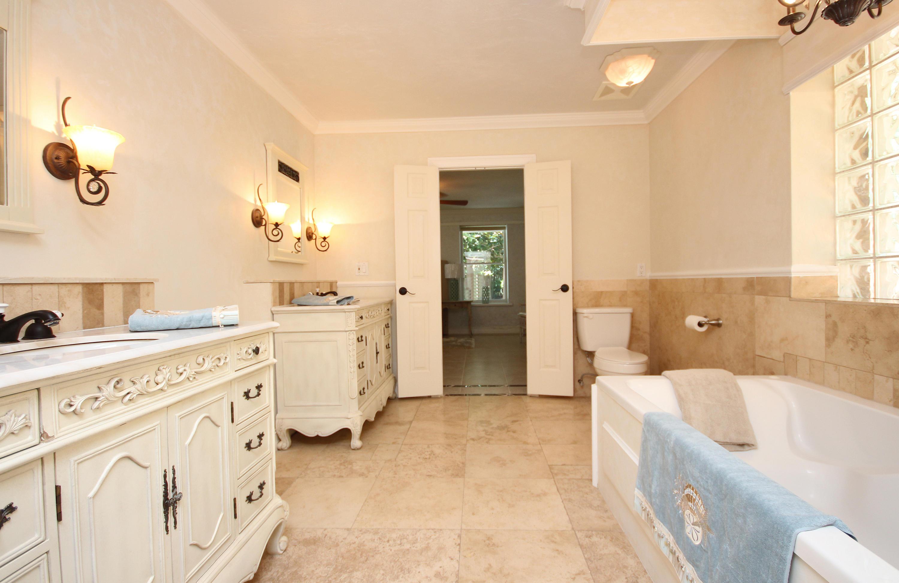 497 Walton Way Miramar Beach, FL 32550 - Photo 25 of 47 a spacious bathroom with a tub sink and mirror