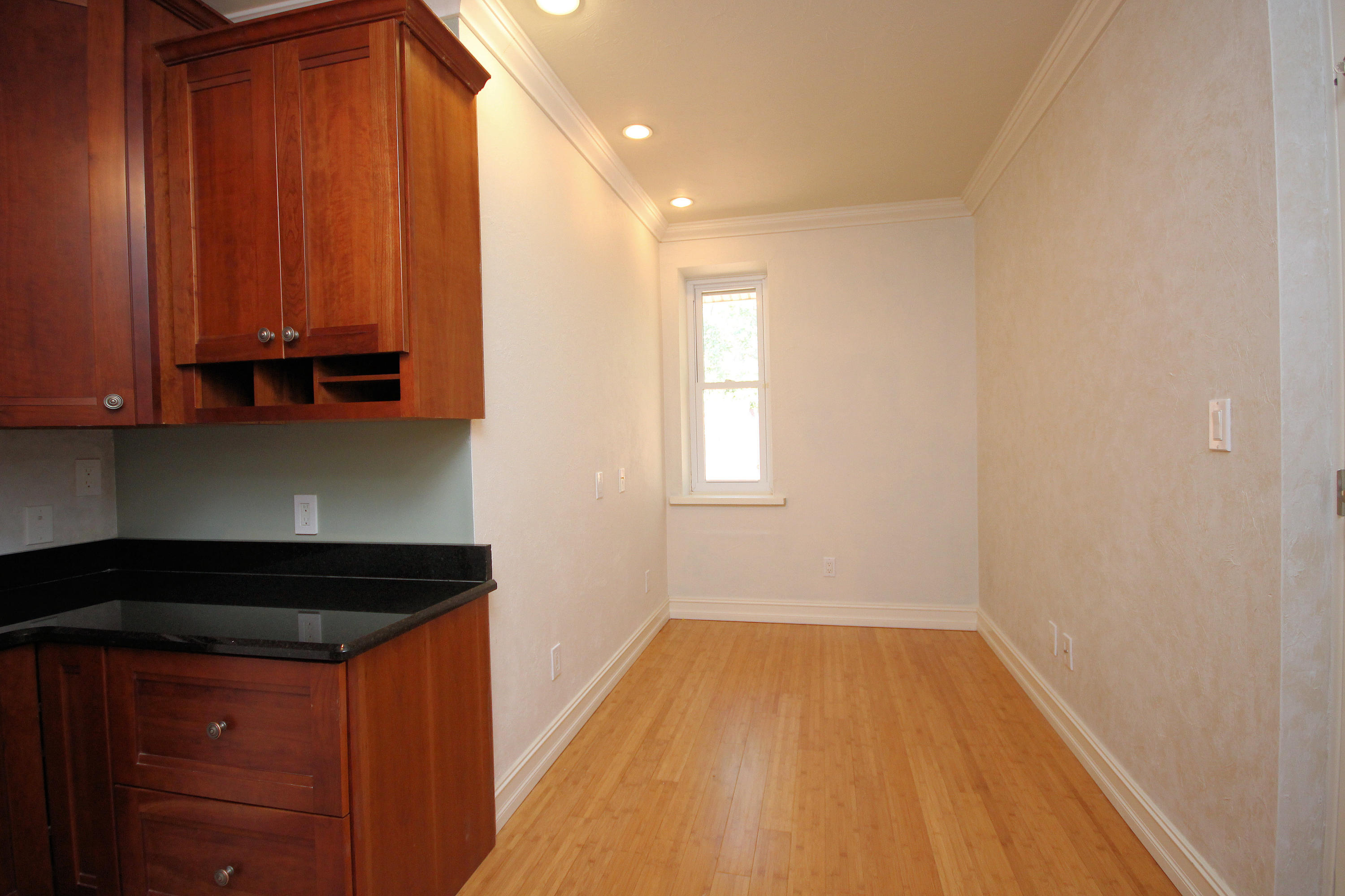 497 Walton Way Miramar Beach, FL 32550 - Photo 26 of 47 a view of a utility room with wooden floor and cabinets