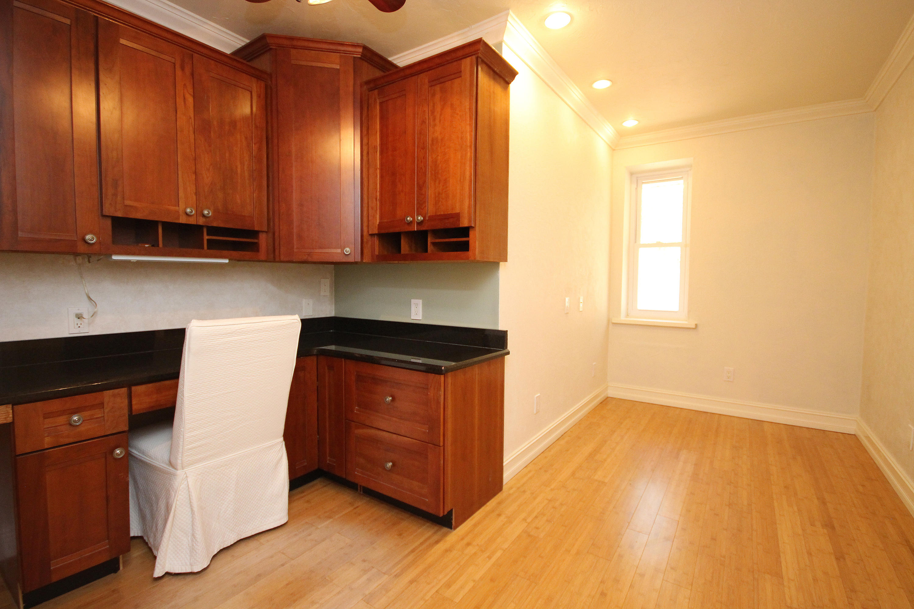 497 Walton Way Miramar Beach, FL 32550 - Photo 27 of 47 a kitchen with stainless steel appliances granite countertop a stove a sink and a microwave