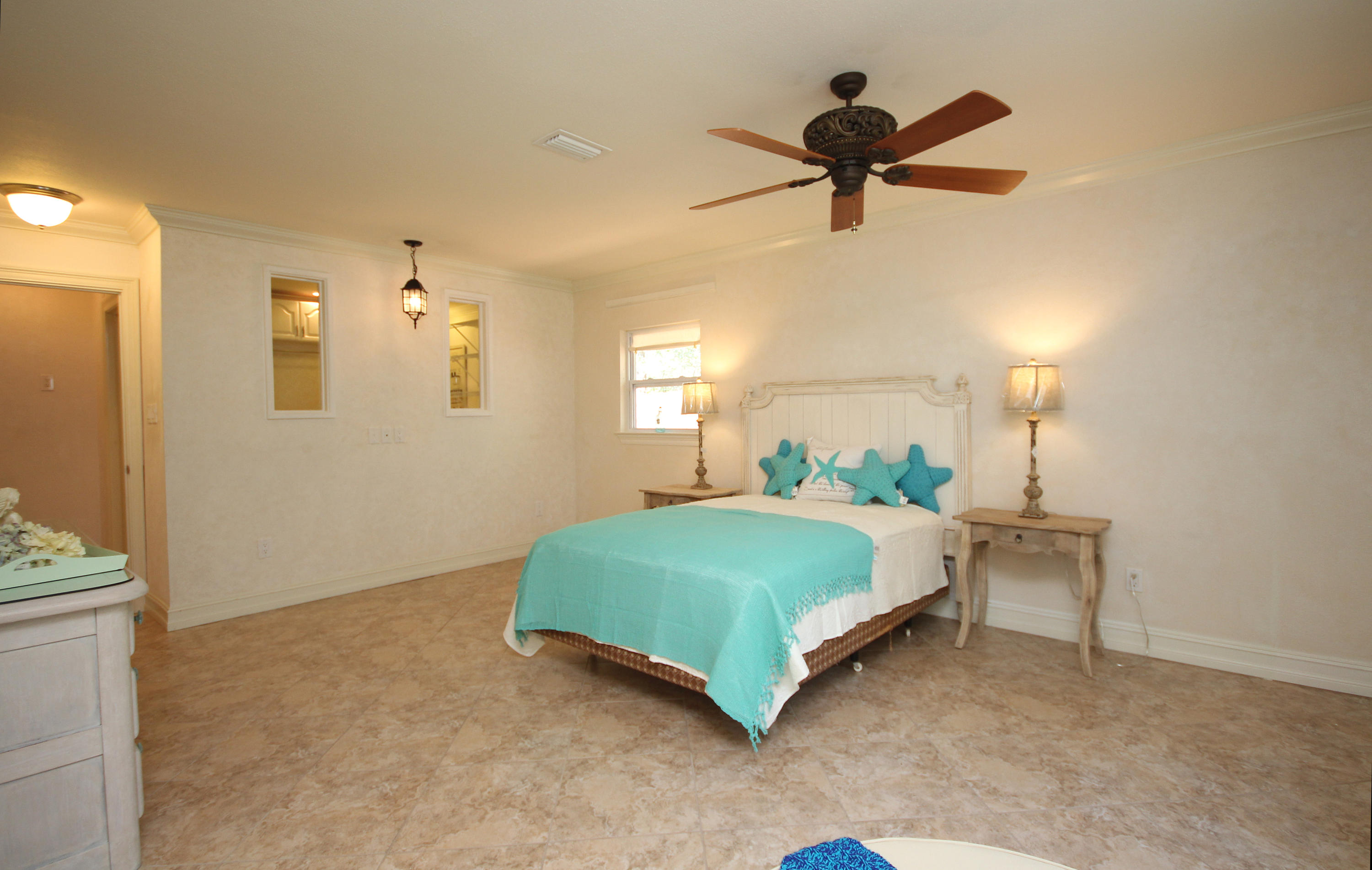 497 Walton Way Miramar Beach, FL 32550 - Photo 29 of 47 a bedroom with a bed and window