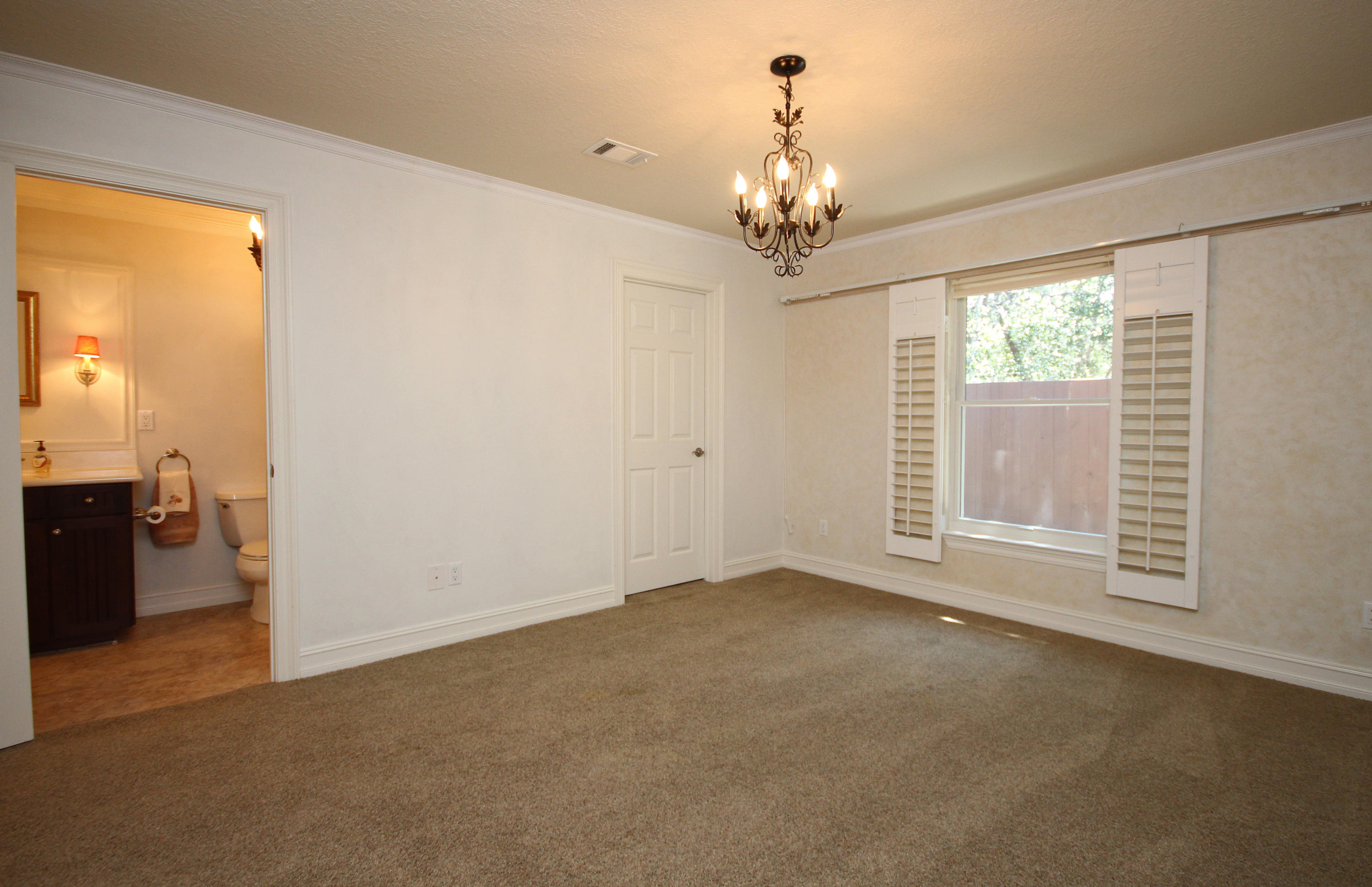 497 Walton Way Miramar Beach, FL 32550 - Photo 32 of 47 a view of a livingroom with a chandelier curtains and large windows