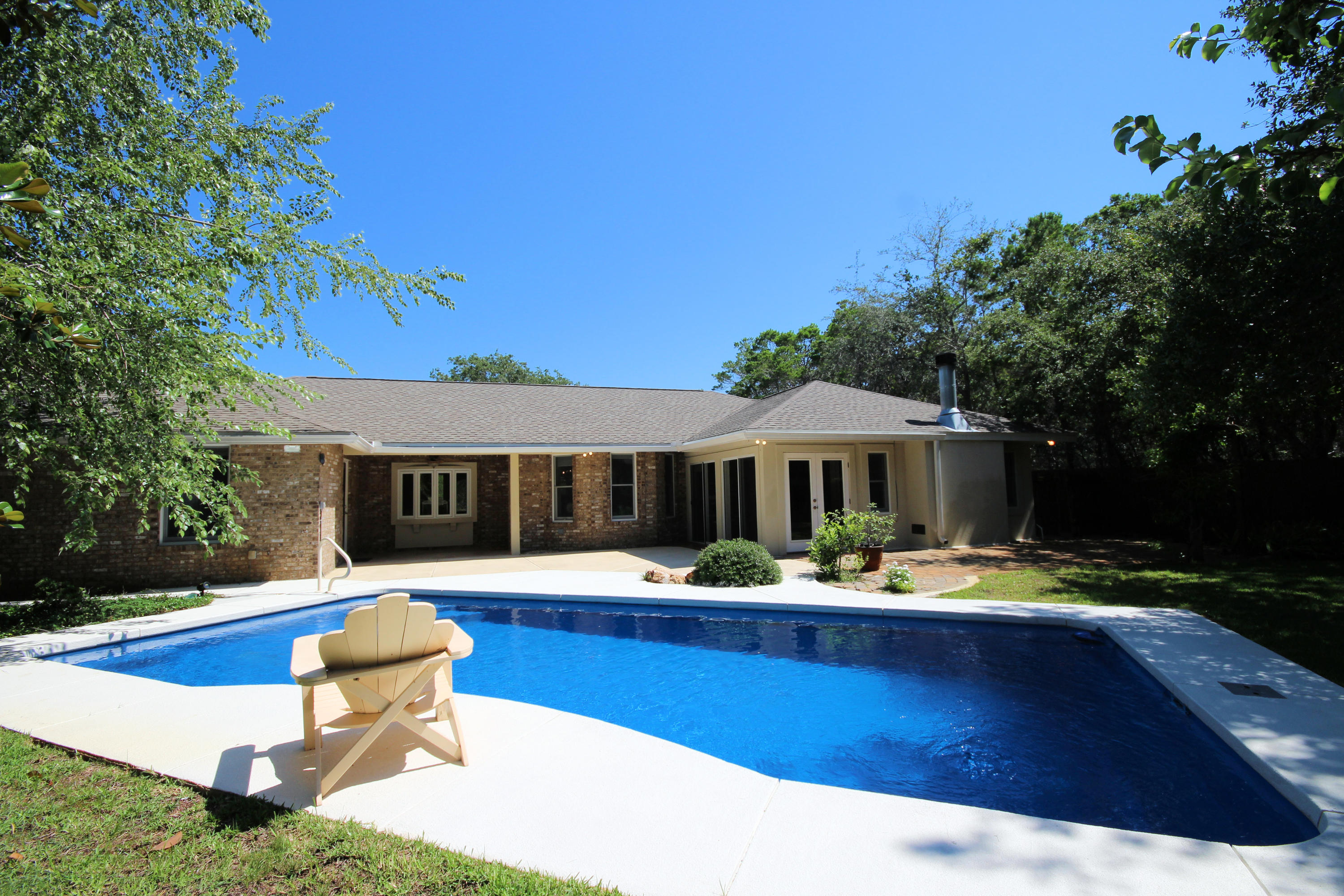 497 Walton Way Miramar Beach, FL 32550 - Photo 35 of 47 a front view of house with yard slide and outdoor seating