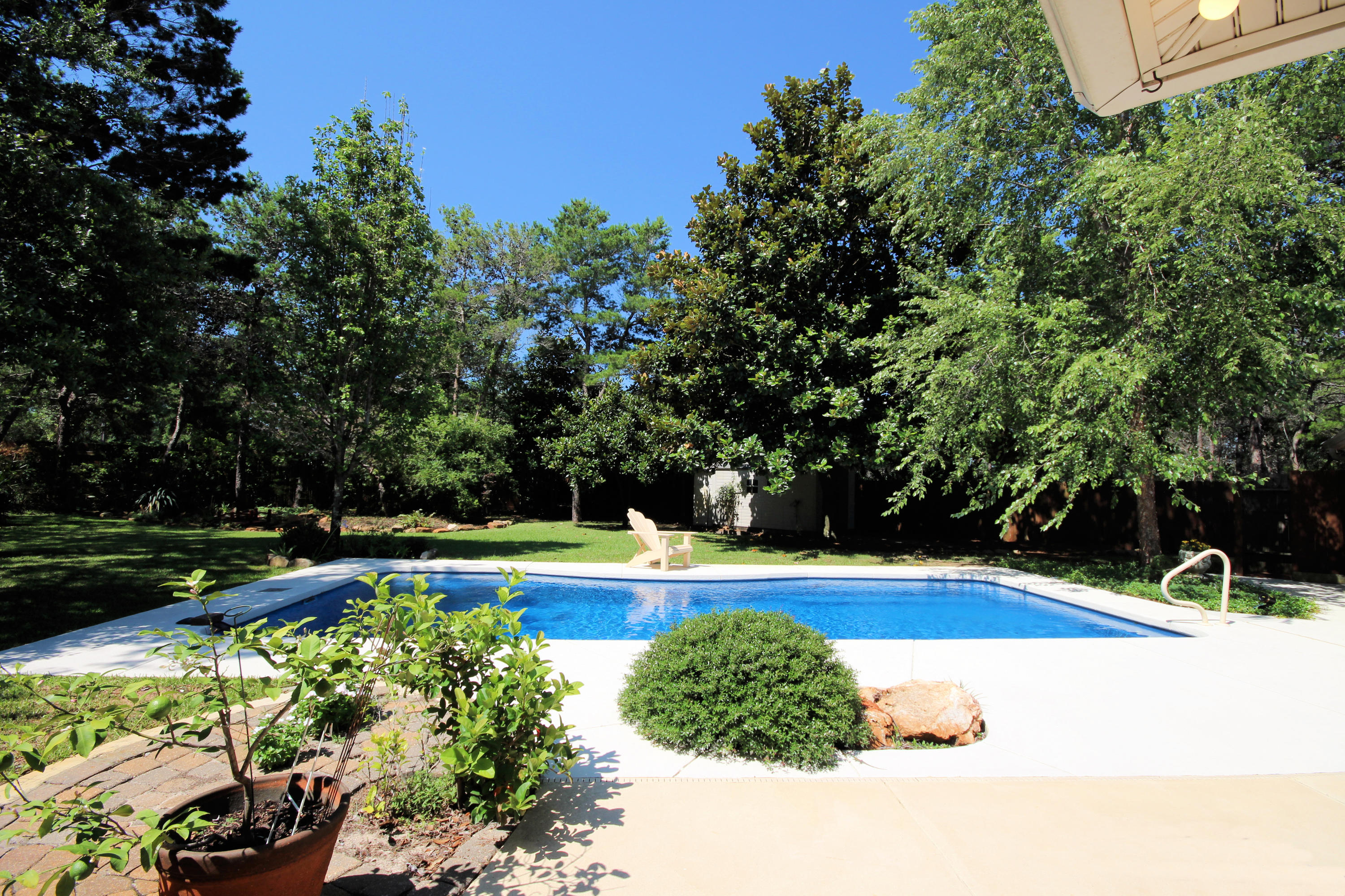 497 Walton Way Miramar Beach, FL 32550 - Photo 38 of 47 a view of a swimming pool and a yard
