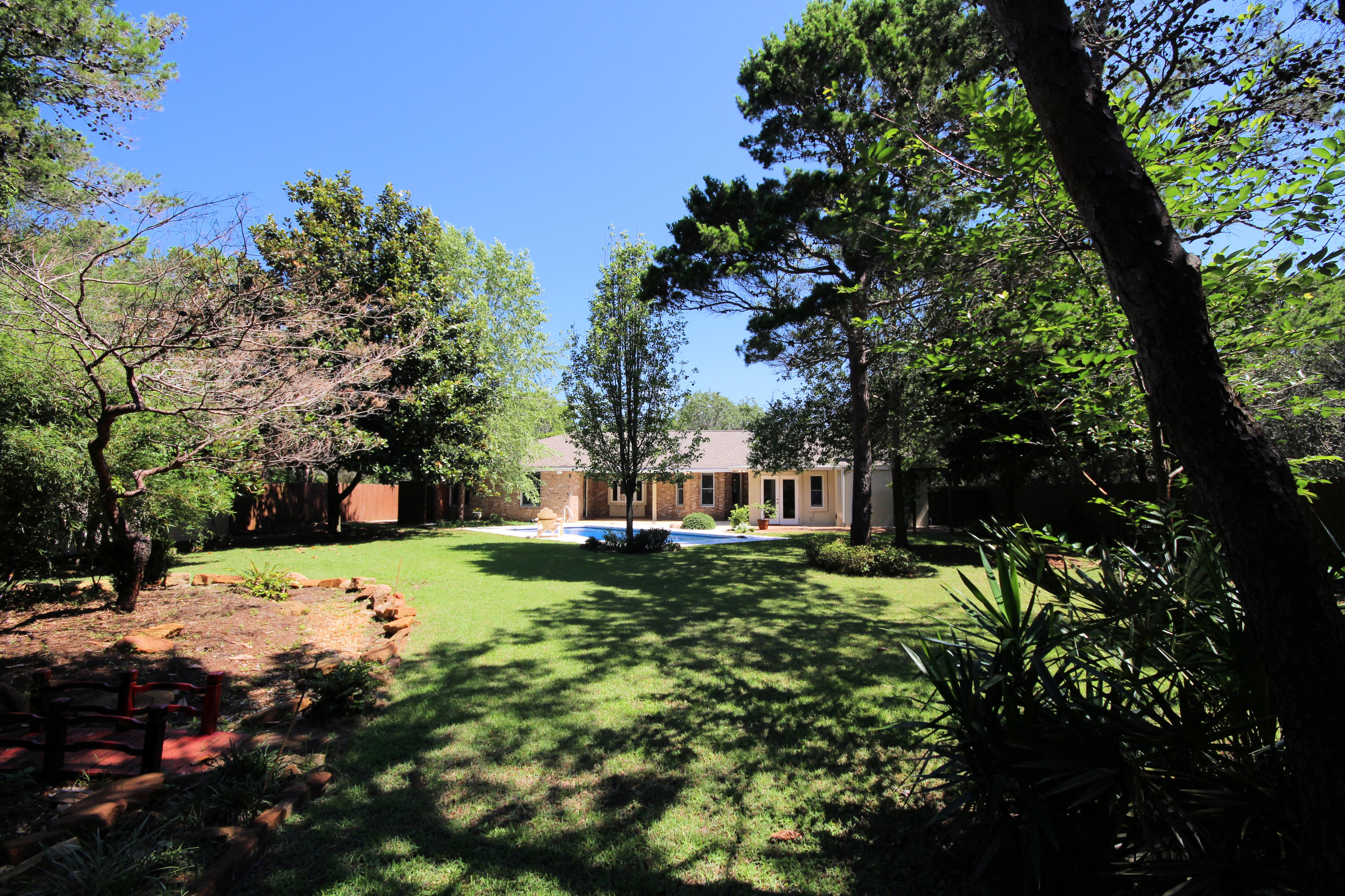 497 Walton Way Miramar Beach, FL 32550 - Photo 40 of 47 a view of a tree in a yard with a fountain
