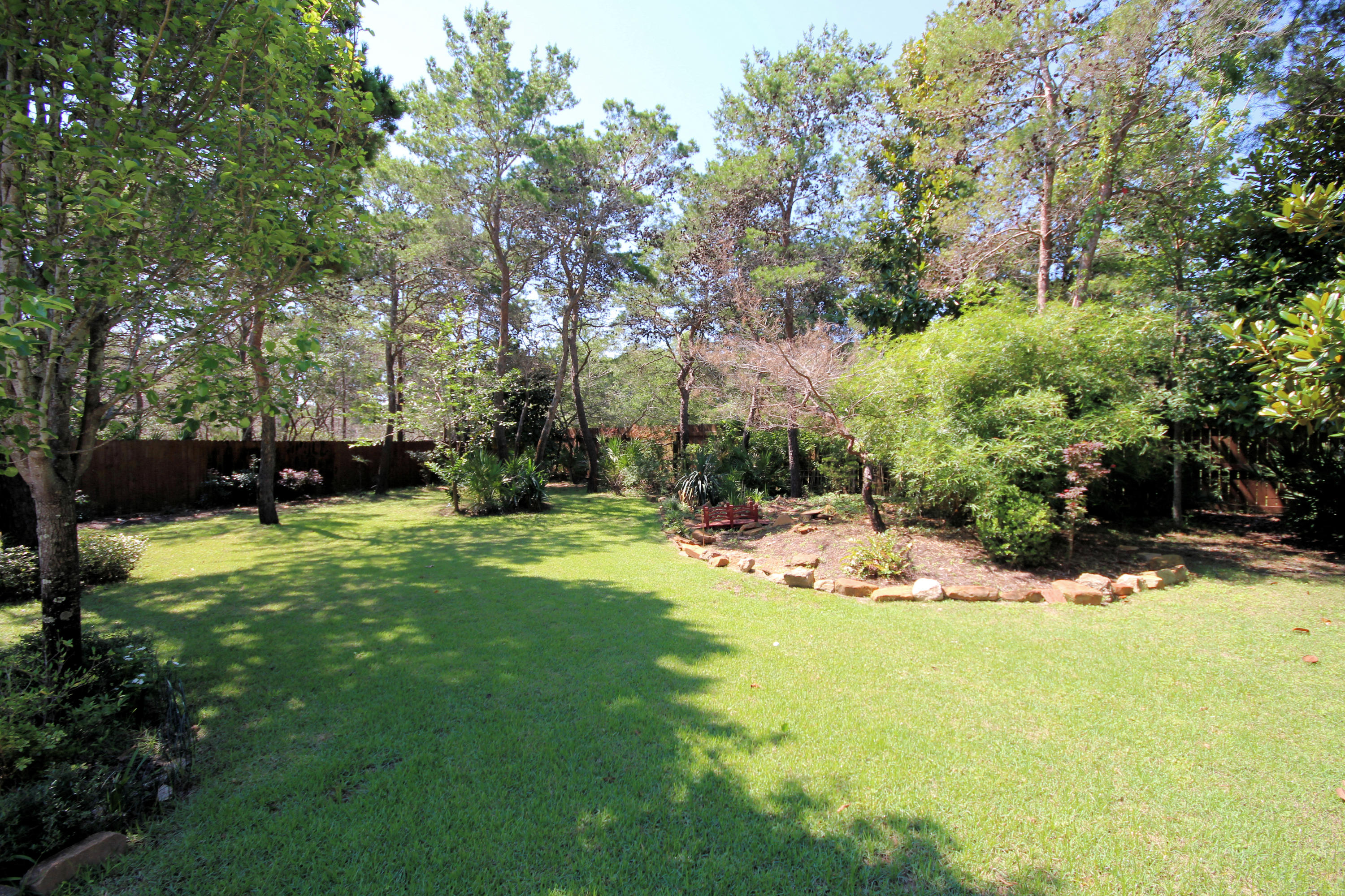 497 Walton Way Miramar Beach, FL 32550 - Photo 42 of 47 a view of a backyard with a garden
