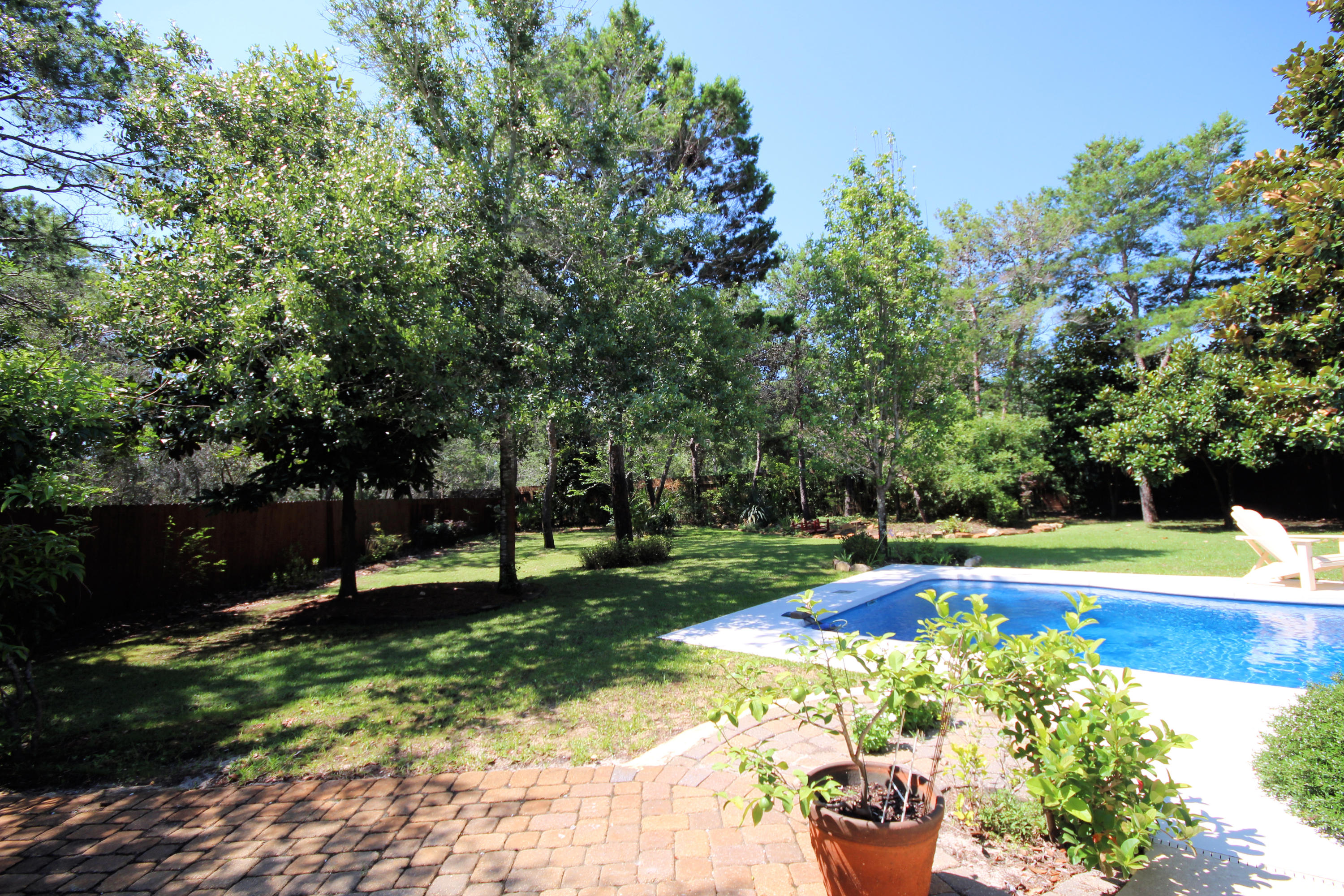 497 Walton Way Miramar Beach, FL 32550 - Photo 43 of 47 a view of a swimming pool with a garden