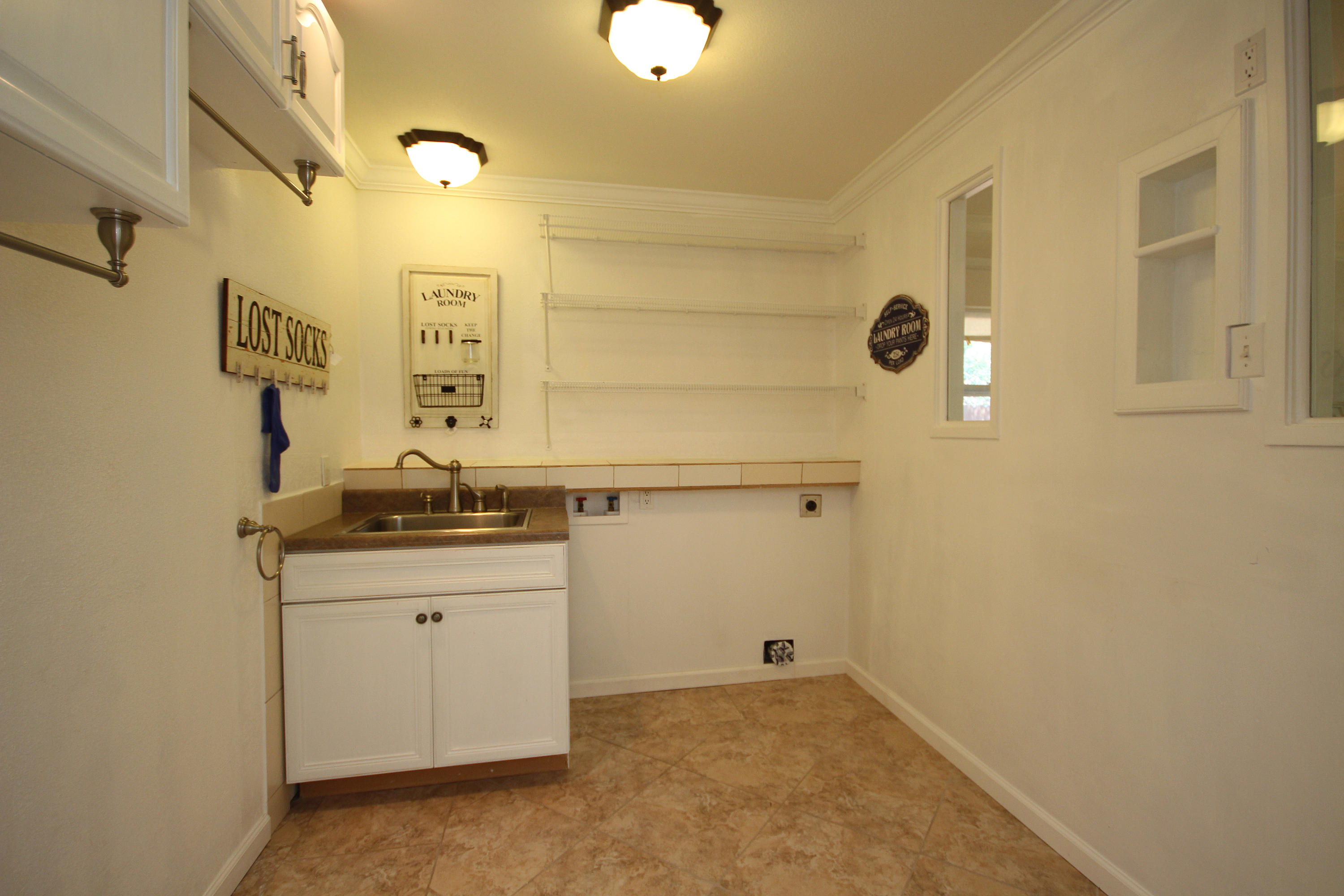 497 Walton Way Miramar Beach, FL 32550 - Photo 45 of 47 a bathroom with a sink and a mirror