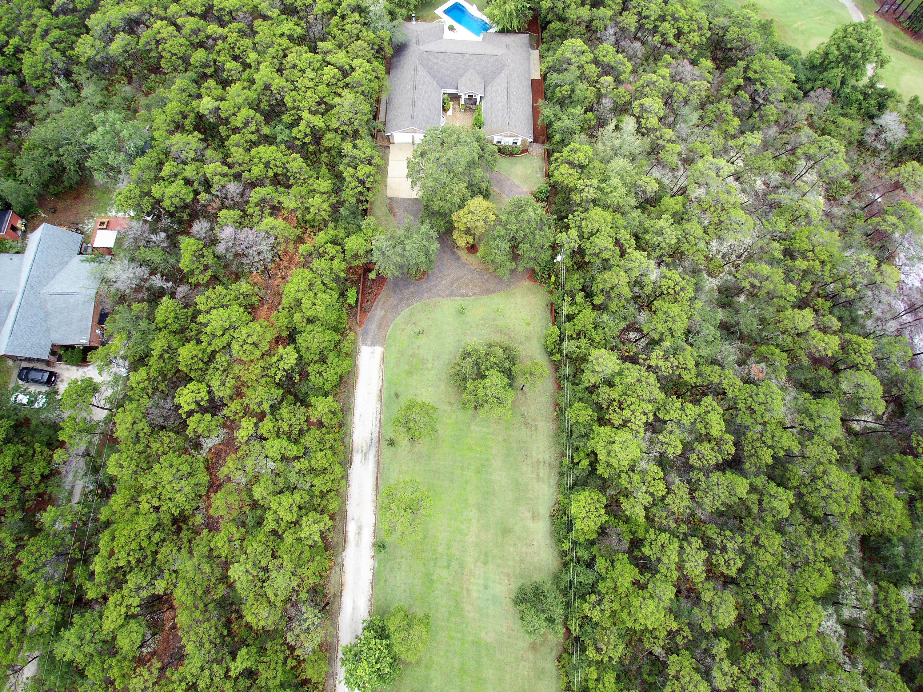 497 Walton Way Miramar Beach, FL 32550 - Photo 47 of 47 an aerial view of a house with a yard