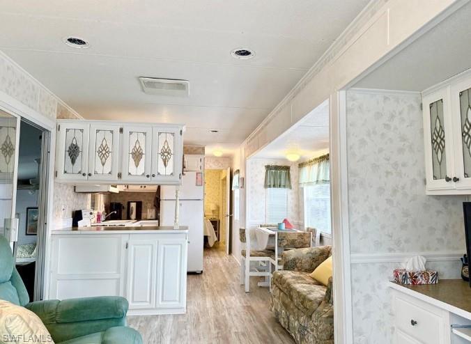 458 Vanda Sanctuary Naples, FL 34114 - Photo 16 of 50 a living room with furniture and a flat screen tv