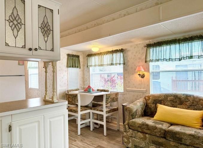 458 Vanda Sanctuary Naples, FL 34114 - Photo 19 of 50 a living room with furniture and wooden floor