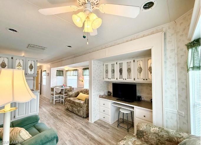 458 Vanda Sanctuary Naples, FL 34114 - Photo 22 of 50 a view of living room filled with furniture and flat screen tv