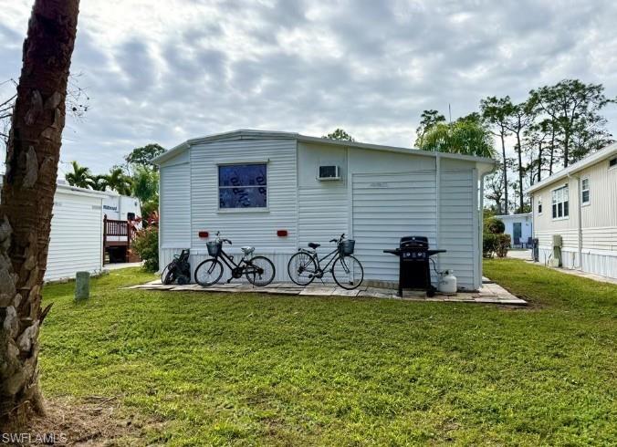 458 Vanda Sanctuary Naples, FL 34114 - Photo 3 of 50 a view of a backyard with sitting area