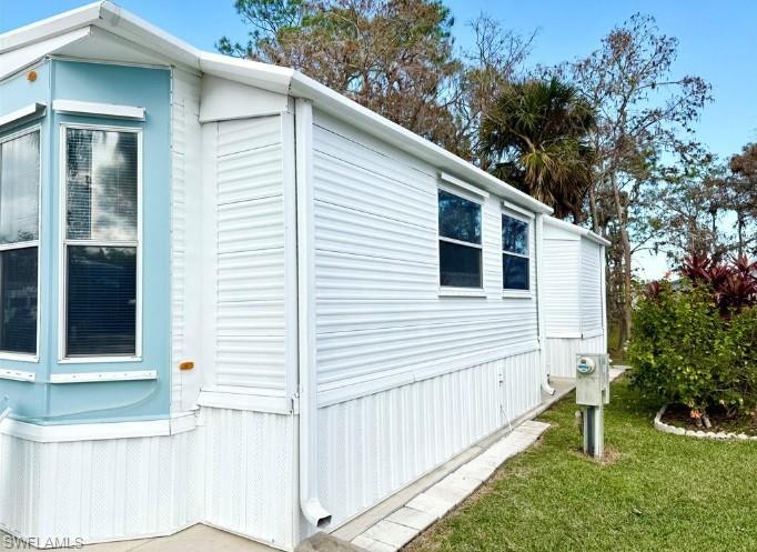458 Vanda Sanctuary Naples, FL 34114 - Photo 4 of 50 a view of a house with a yard