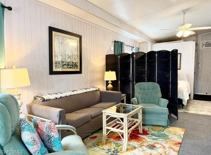 458 Vanda Sanctuary Naples, FL 34114 - Photo 10 of 50 a living room with furniture and a flat screen tv