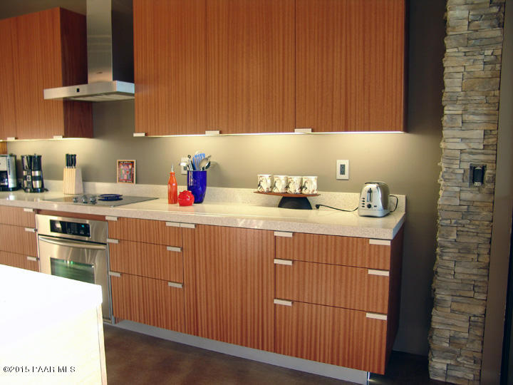 19925 North Lower Territory Road Prescott, AZ 86305 - Photo 12 of 41 a kitchen with a sink dishwasher stove and cabinets