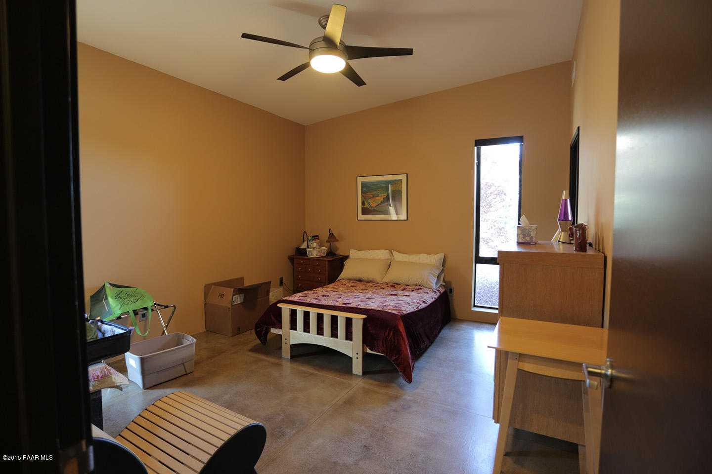 19925 North Lower Territory Road Prescott, AZ 86305 - Photo 18 of 41 a bedroom with a bed and a chandelier