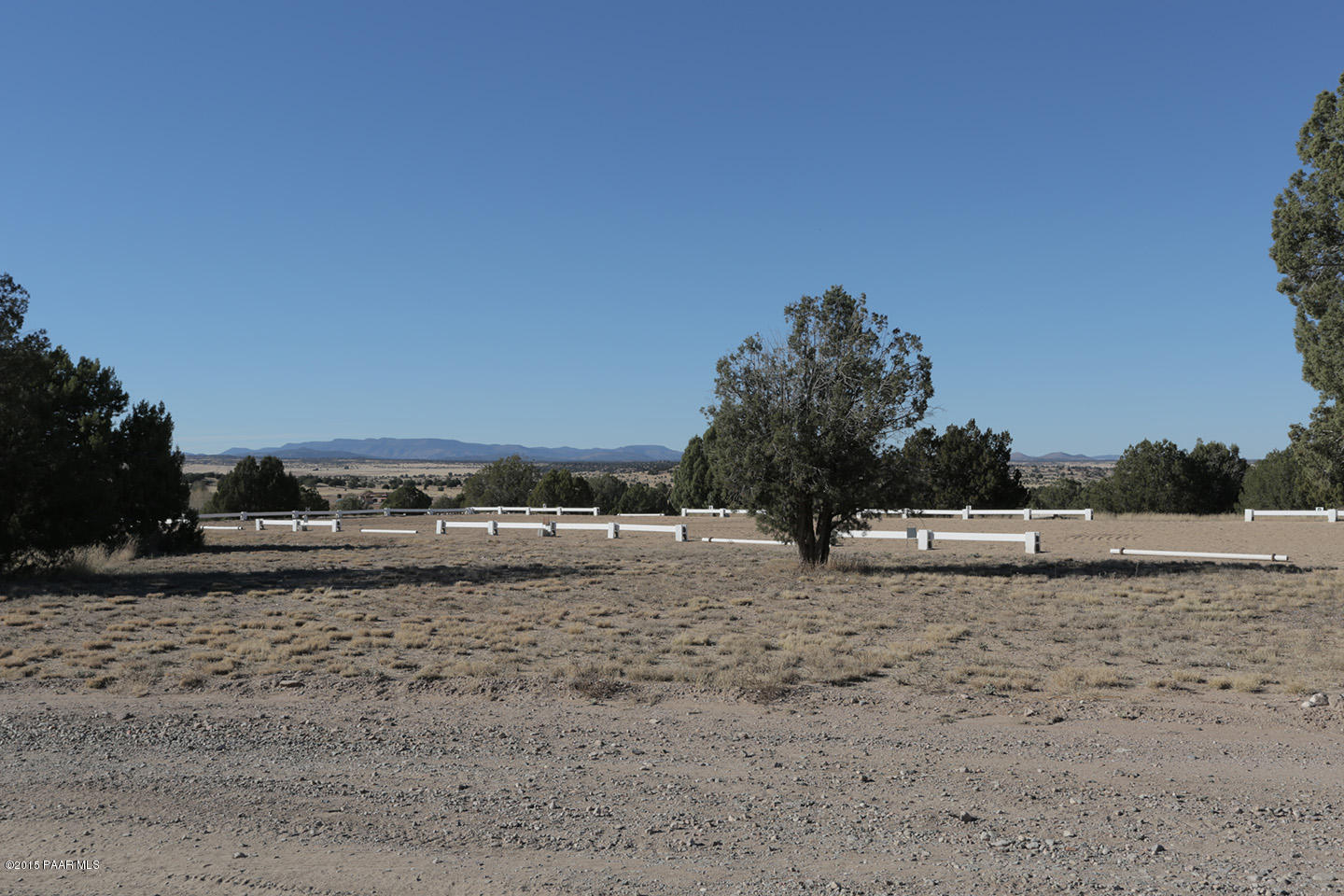 19925 North Lower Territory Road Prescott, AZ 86305 - Photo 25 of 41 a view of a dry yard with a house in the background