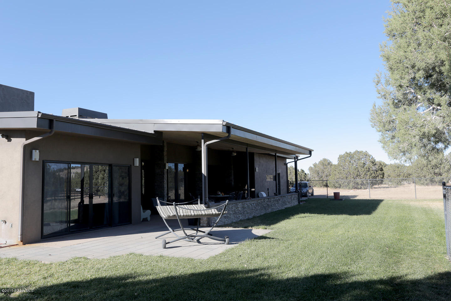 19925 North Lower Territory Road Prescott, AZ 86305 - Photo 34 of 41 a view of a backyard with a patio and outdoor seating