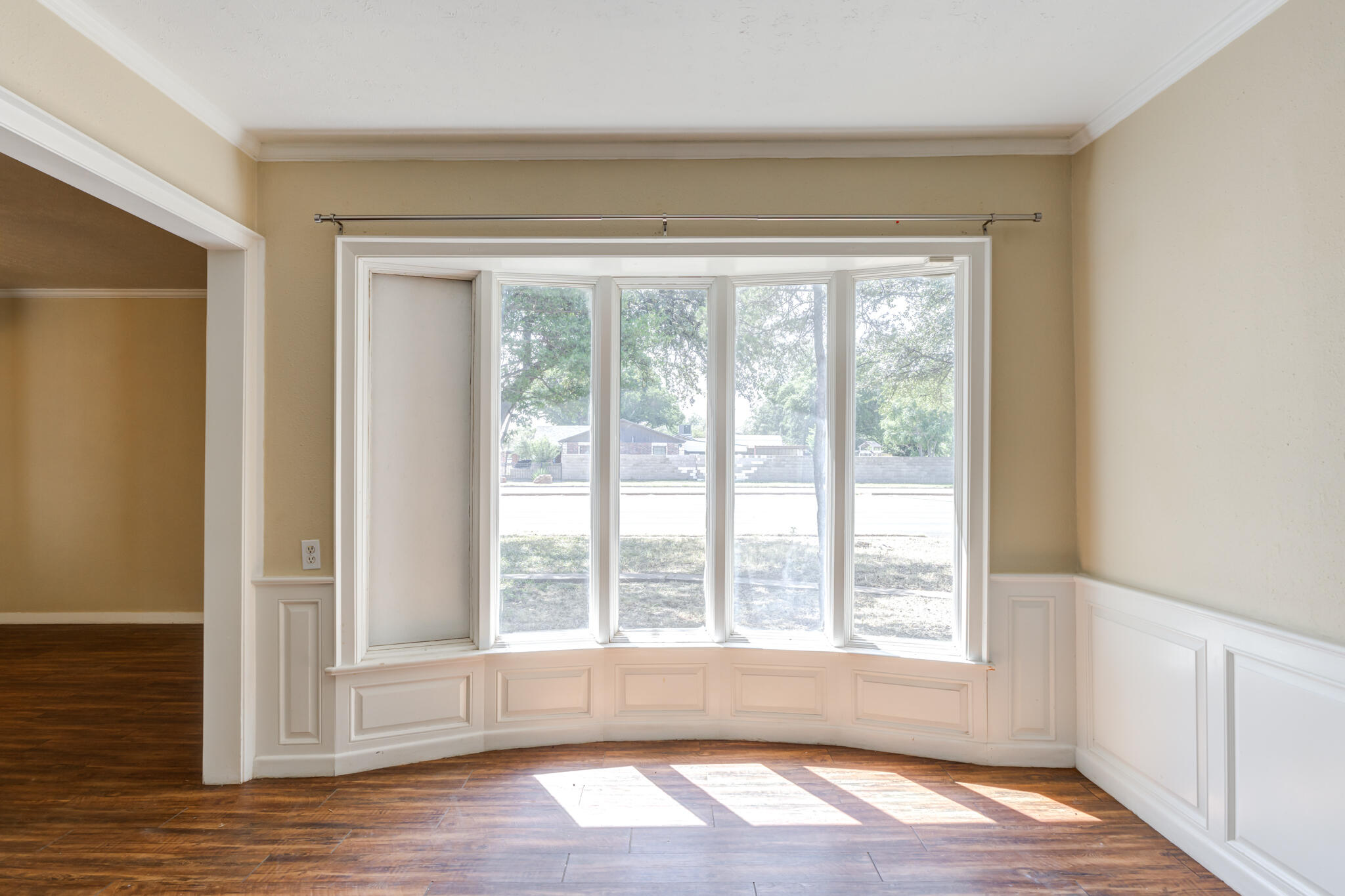 2420 39th Street Lubbock, TX 79412 - Photo 12 of 39 a view of empty room with wooden floor and fan