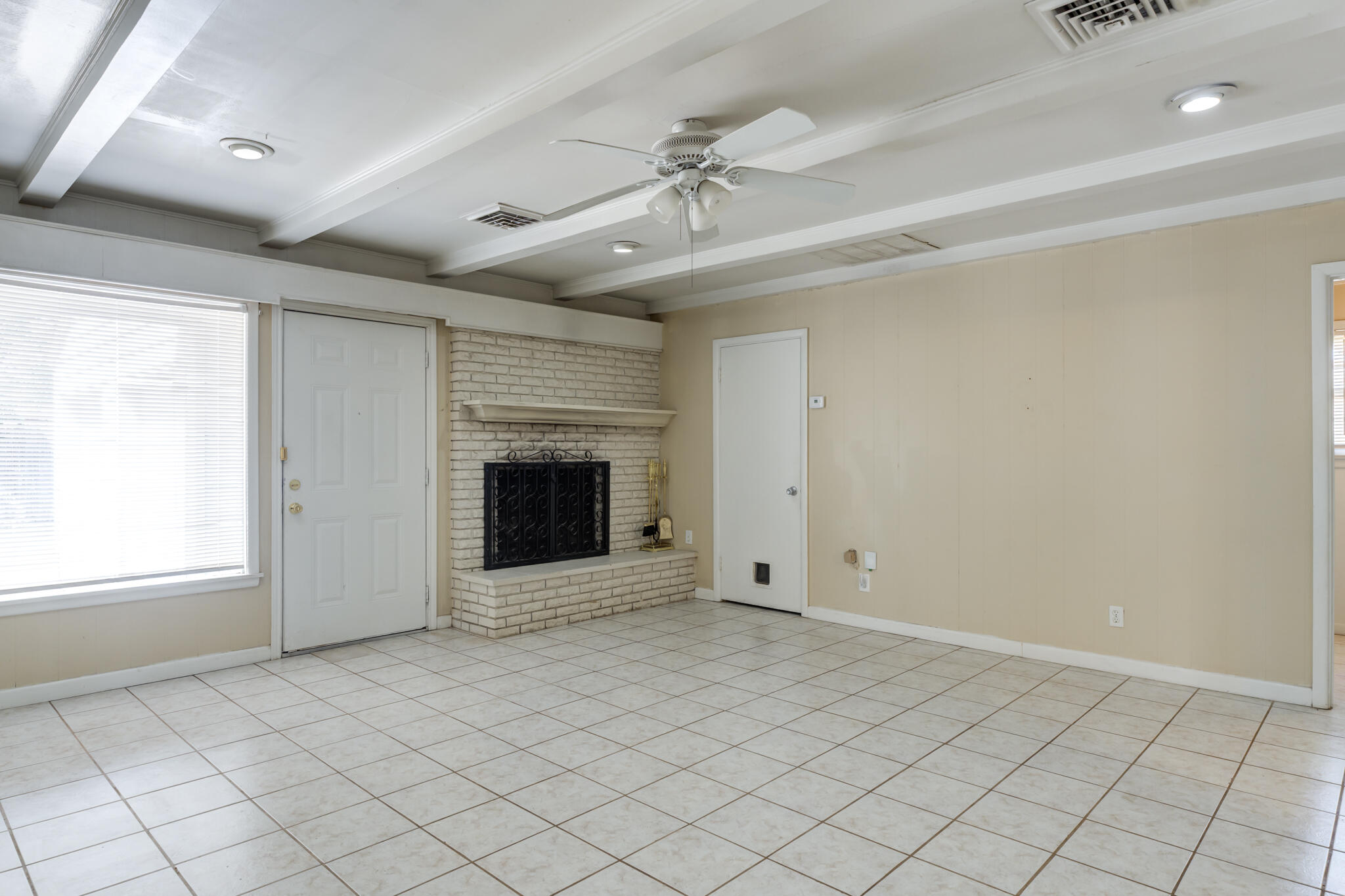 2420 39th Street Lubbock, TX 79412 - Photo 20 of 39 an empty room with windows and fireplace