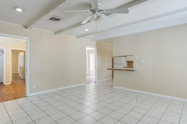 wooden floor in an empty room and a window